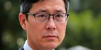 Evan Low looking serious in an outdoor setting.