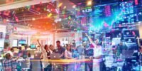 Celebrating investors in a modern office, vibrant atmosphere.
