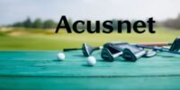 Golf equipment displayed on wood with a blurred background.